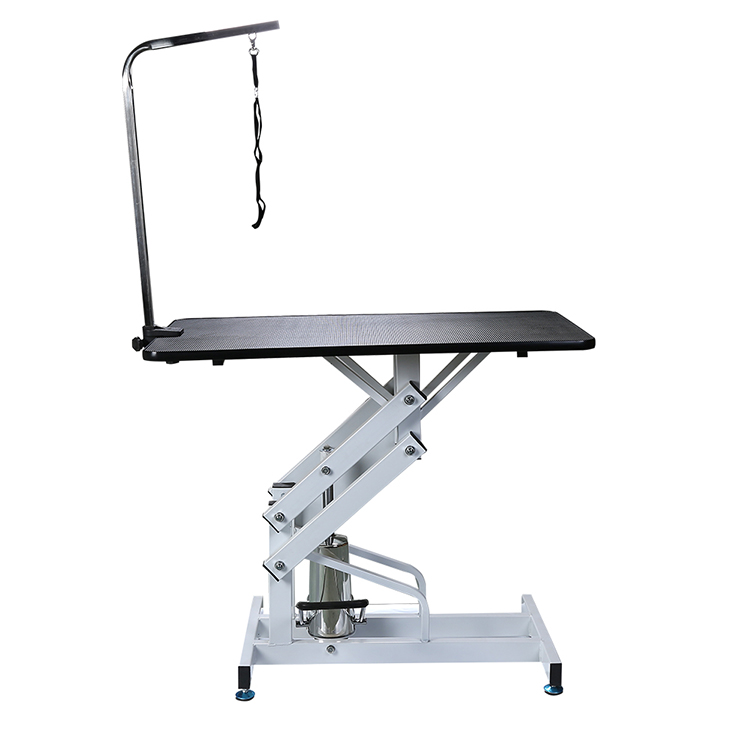 Hydraulically raised pet grooming table